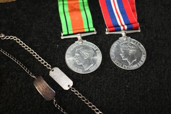 2 x WWII Medals and 2 silver tags to Cowan